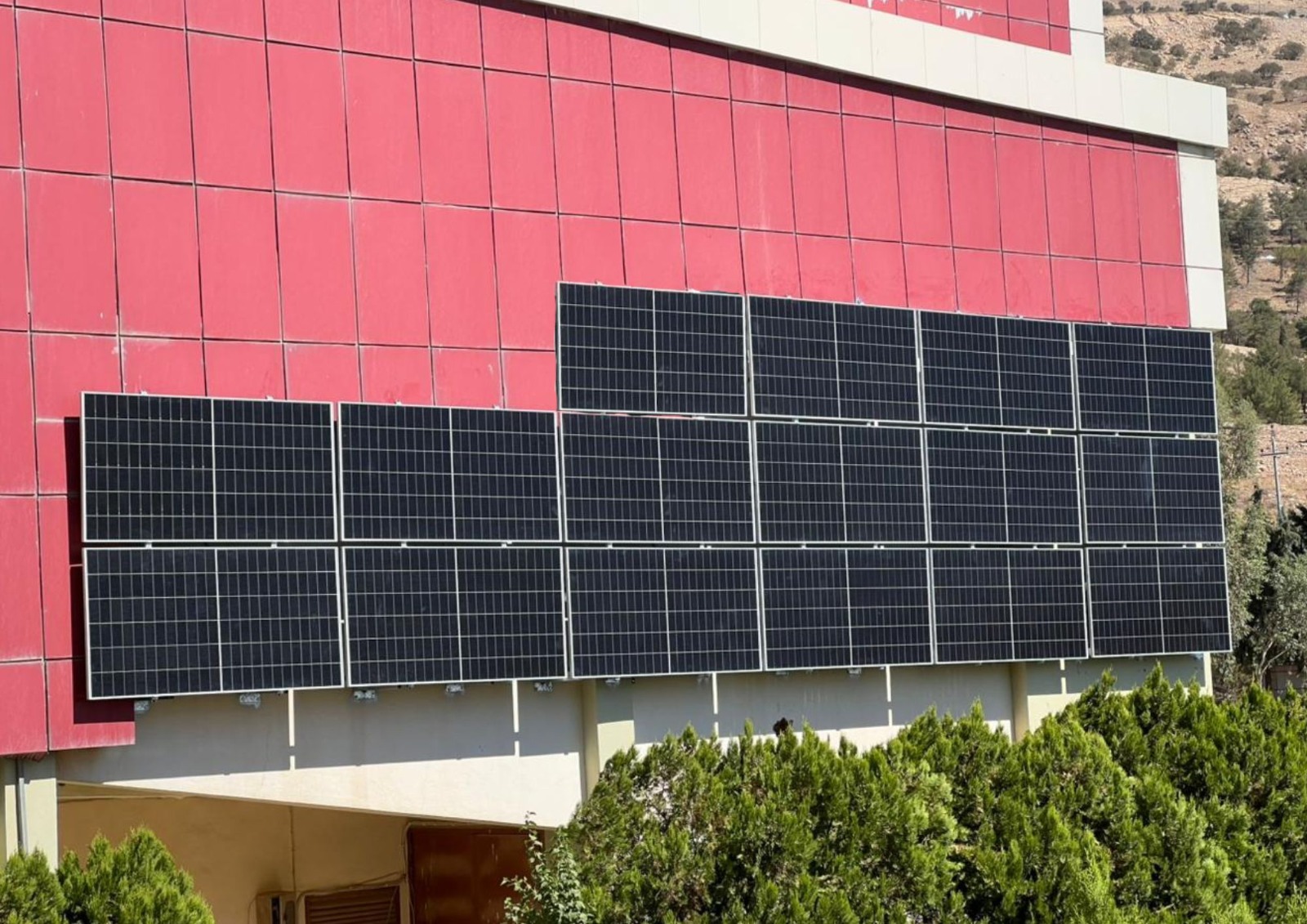 Facade-mounted solar panels on a Koya University campus building