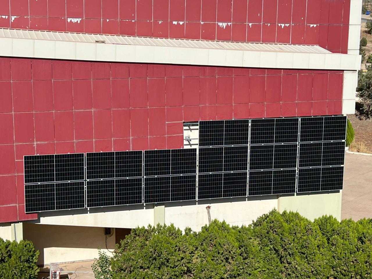 Facade-mounted solar panels on a Koya University campus building